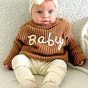 Anastasia joined the competition — help win amazing prizes! baby, infant, child, headband, bow, sweater, knitwear, clothing, sitting, blue_eyes, cute, portrait, cozy, blanket, soft, indoor, person, fashion, adorable, young