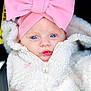 adorable, baby, blue_eyes, candid, child, close_up, cute, expression, face, fashion, fluffy_jacket, headband, infant, pink_bow, portrait, puckered_lips, soft_texture, warm_clothing, white_jacket, young