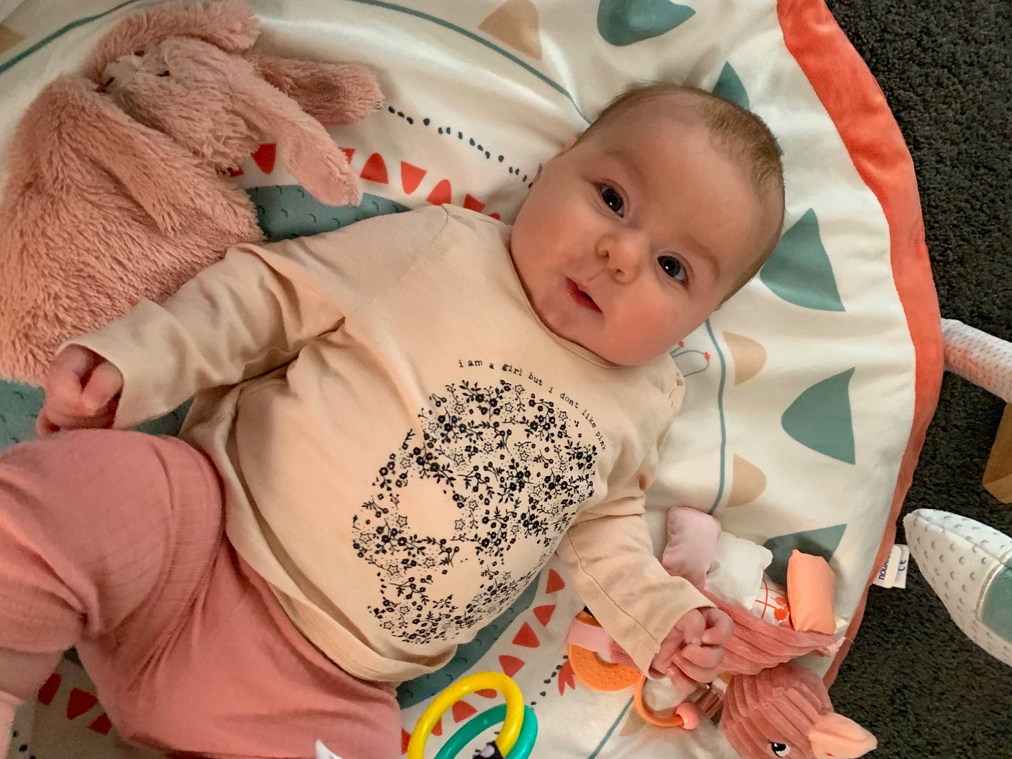 Adèle participe au concours pour gagner de l'argent avec cette photo : baby, baby_carriage, baby_products, baby_sleeping, baby_toddler_clothing, cheek, child, comfort, eye, facial_expression, iris, linens, pattern, person, pink, room, sitting, skin, sleeve, textile