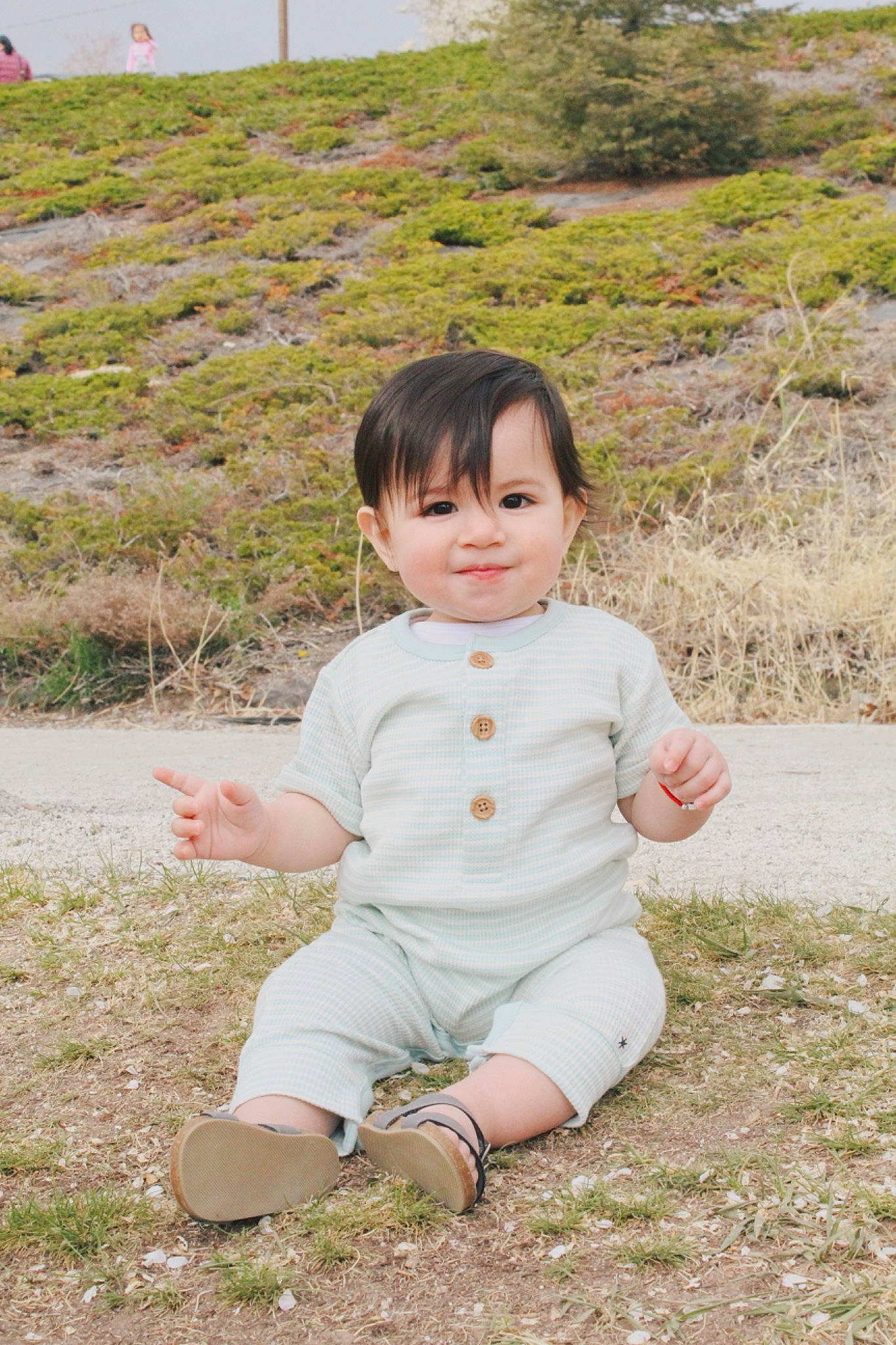 Liam is registered to the contest to win money with this photo: baby, baby_toddler_clothing, child, fun, grass, grassland, happy, joy, landscape, leaf, meadow, people_in_nature, person, plant, portrait_photography, prairie, recreation, sitting, sleeve, soil