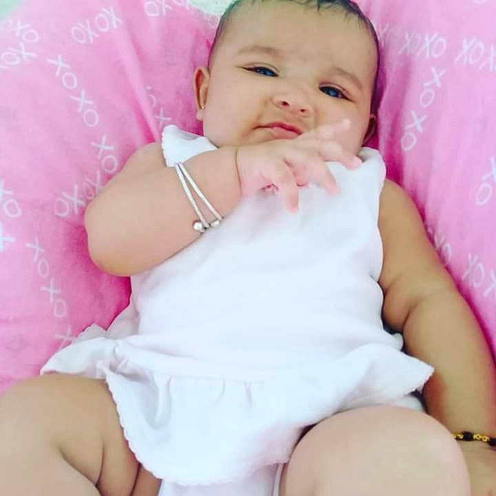 Safia joined the competition — help win amazing prizes! baby, baby_sleeping, baby_toddler_clothing, cheek, child, comfort, eyelash, face, fashion_accessory, happy, linens, magenta, pattern, person, pink, purple, skin, sleeve, thigh, toddler