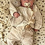 Constance participe au concours pour gagner de l'argent avec cette photo : baby, pacifier, plush_toy, blanket, heart_socks, infant, clothing, cute, lying_down, soft_toy, floral_pattern, comfort, child, adorable, pajamas, bedtime, resting, small_hands, indoor, cozy