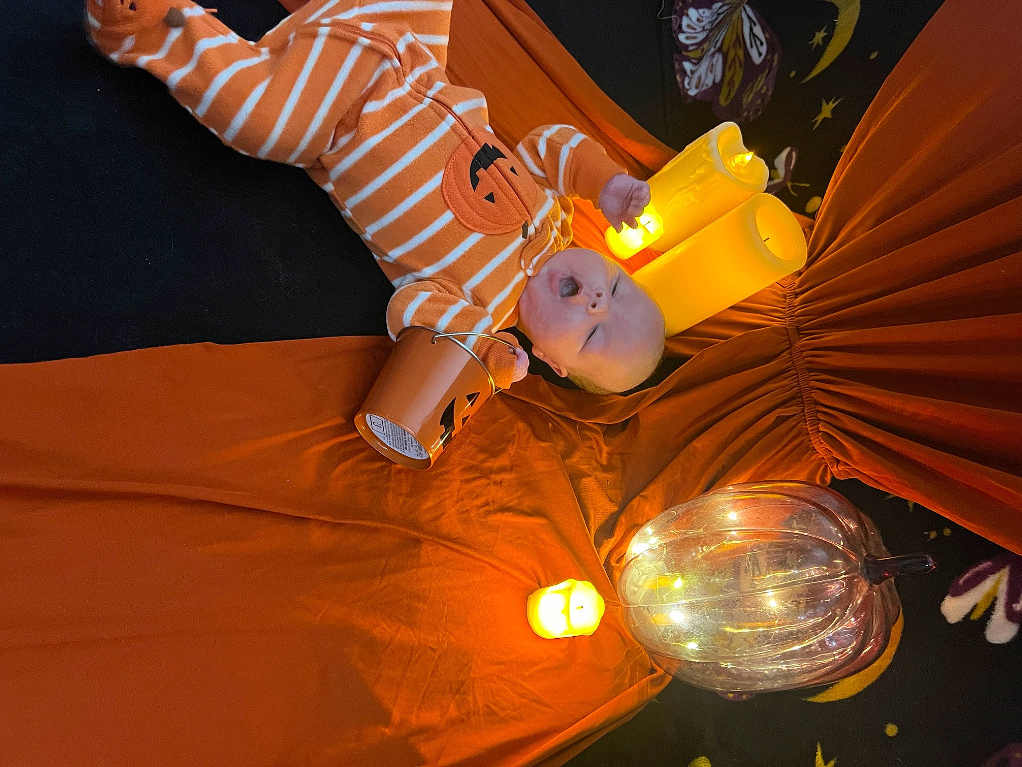 Warren is registered to the contest to win money with this photo: automotive_lighting, ceiling, ceiling_fan, circle, event, fun, lamp, lantern, light_bulb, light_fixture, lighting_accessory, metal, orange, person, room, space, tree