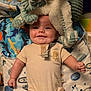 Leo joined the competition — help win amazing prizes! baby, smiling, infant, plush_toy, blanket, space_theme, clothing, onesie, cute, happy, child, indoor, portrait, soft_toy, fabric, lying_down, head, face, hand, buttoned_clothing