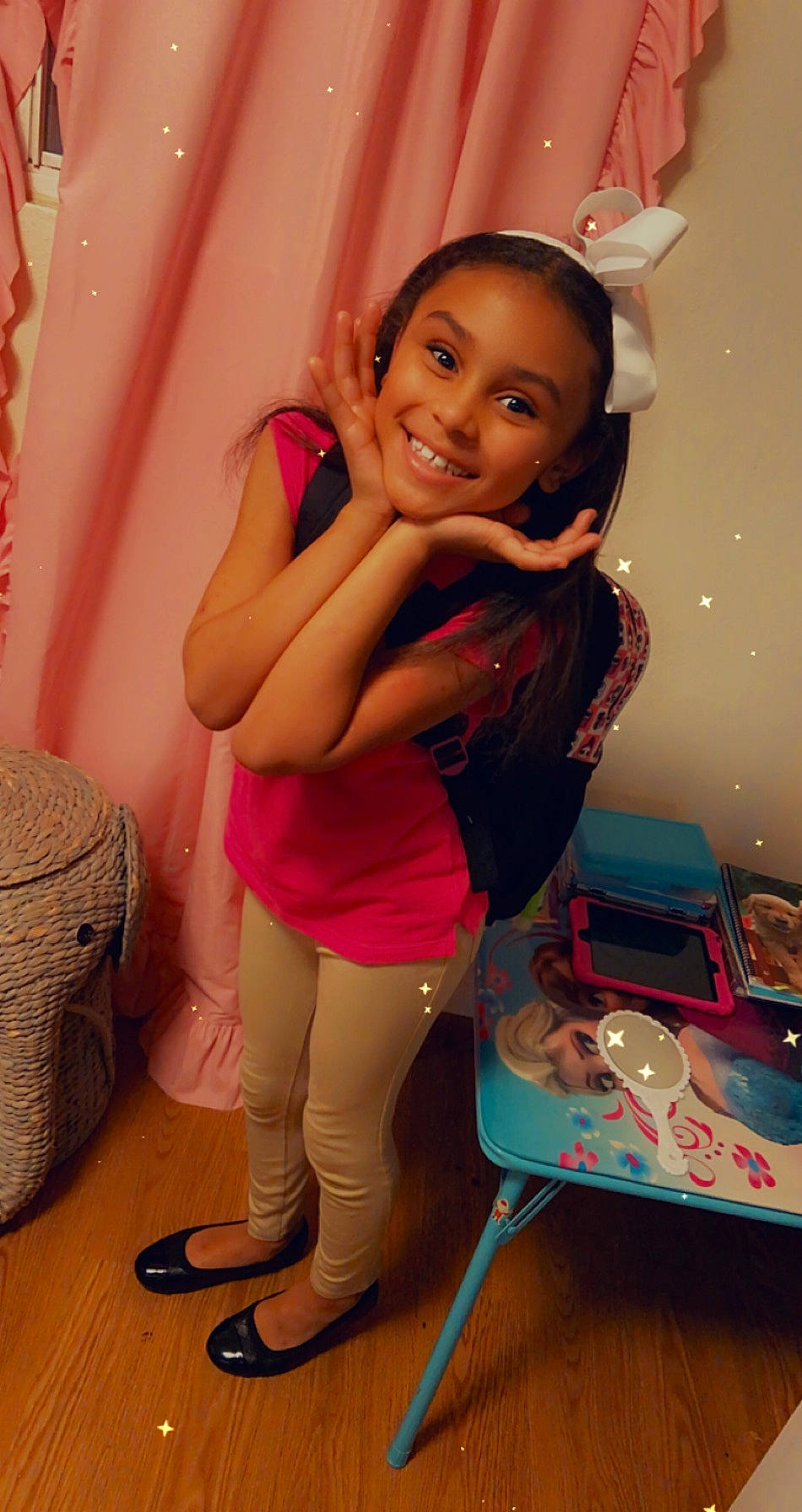 Dalilah is registered to the contest to win money with this photo: bag, child, event, fun, happy, human_leg, joint, joy, knee, leisure, luggage_and_bags, magenta, person, pink, room, sandal, shoe, shoulder, sitting, smile