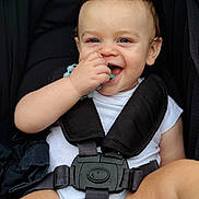 Hudson joined the competition — help win amazing prizes! baby, child, smiling, teething_toy, stroller, harness, white_onesie, blue_eyes, happy, cute, infant, hand, face, sitting, baby_toy, closeup, skin, mouth, person, young