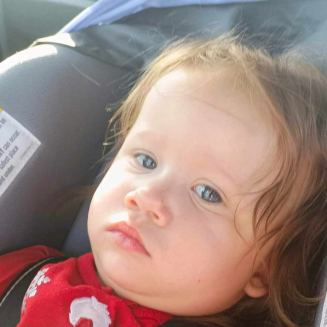 Terra is registered to the contest to win money with this photo: accessories, baby, bodypart, car, car_interior, carseat, clothing, coat, cushion, face, finger, hand, head, homedecor, jacket, person, photography, portrait, transportation, vehicle