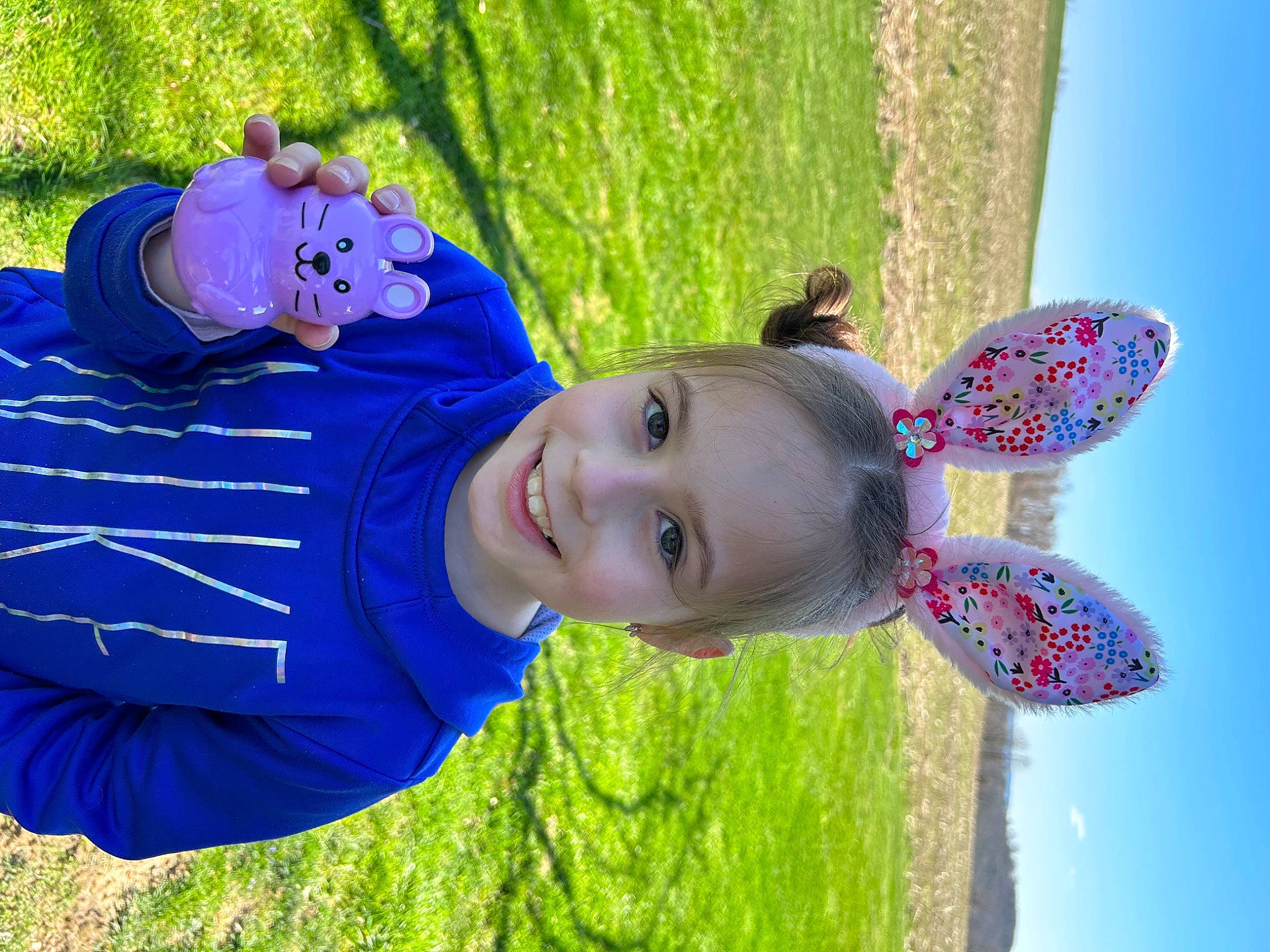 Paislee is registered to the contest to win money with this photo: azure, blue, electric_blue, fun, grass, green, happy, hat, joy, leaf, leisure, nature, people_in_nature, person, plant, recreation, sky, smile, summer, toddler