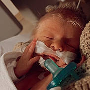 Waylon joined the competition — help win amazing prizes! newborn, baby, infant, sleeping, pacifier, nasal_cannula, medical_tube, hospital, swaddle, blanket, hand, face, closeup, portrait, peaceful, tiny, monitoring, skin, crib, soft_lighting