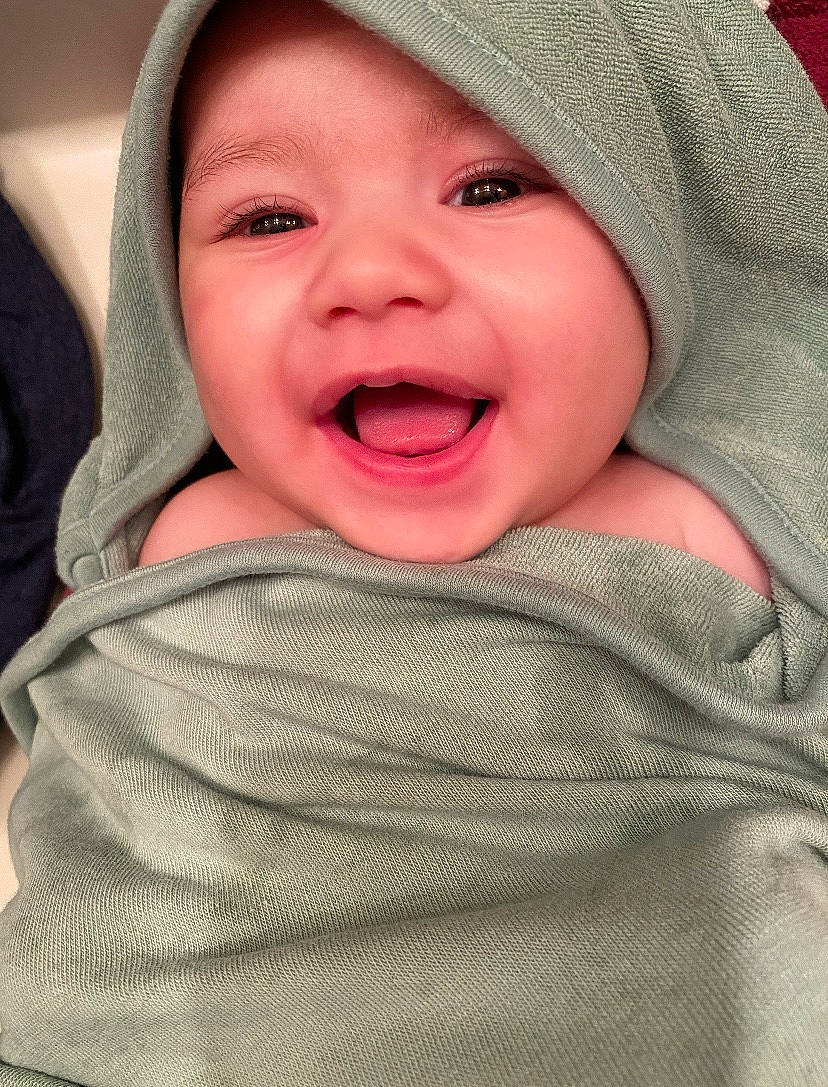 Ian is registered to the contest to win money with this photo: baby, baby_laughing, cheek, child, chin, close_up, eye, face, facial_expression, happy, head, headwear, laugh, lip, mouth, nose, person, skin, smile, toddler