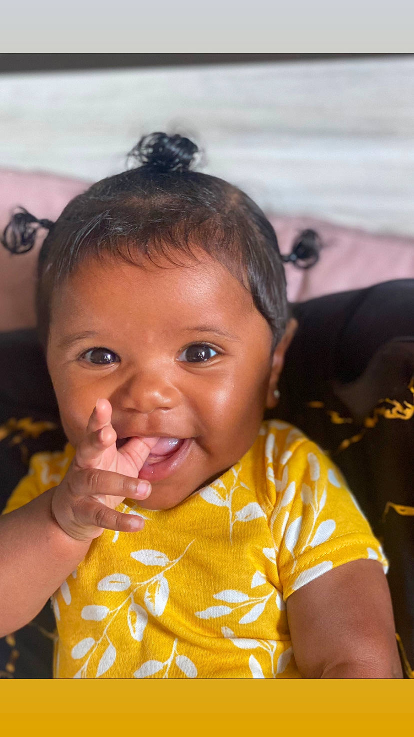 Sophia is registered to the contest to win money with this photo: arm, black_hair, cheek, ear, eyelash, facial_expression, finger, forehead, gesture, hair, hand, happy, iris, lip, mouth, neck, nose, person, skin, smile