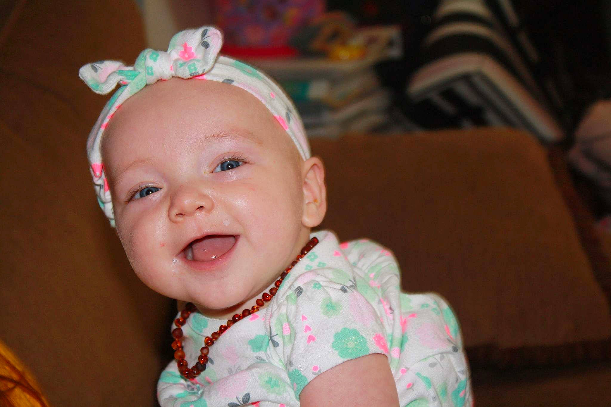 Madelynn joined the competition — help win amazing prizes! baby, baby_laughing, cheek, child, ear, face, facial_expression, fun, hair_accessory, happy, head, headband, headgear, iris, laugh, lip, person, pink, skin, smile