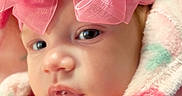 Bianca Rose joined the competition — help win amazing prizes! baby, infant, child, face, portrait, close_up, pink_bow, hair_accessory, wide_eyes, looking_at_camera, drool, blanket, fluffy, pastel, pink, cozy, indoors, soft_lighting, cute, headshot