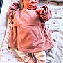 baby, blanket, child, comfort, cozy, cute, fabric, foot, indoors, infant, lying_down, newborn, person, pink_clothing, portrait, relaxing, sleeping_bed, small_hands, soft_texture, stars