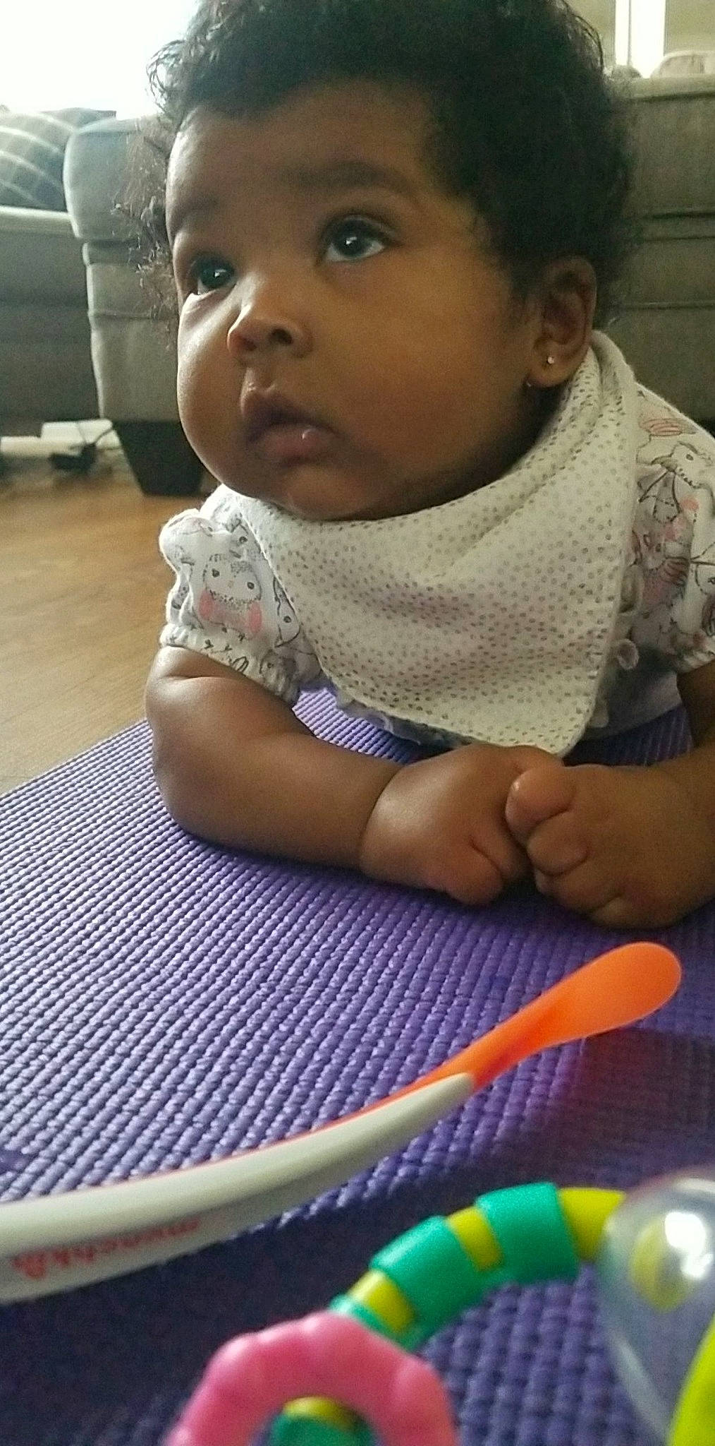 Noel is registered to the contest to win money with this photo: baby, cheek, child, face, head, nose, person, play, sitting, skin, smile, toddler, tummy_time