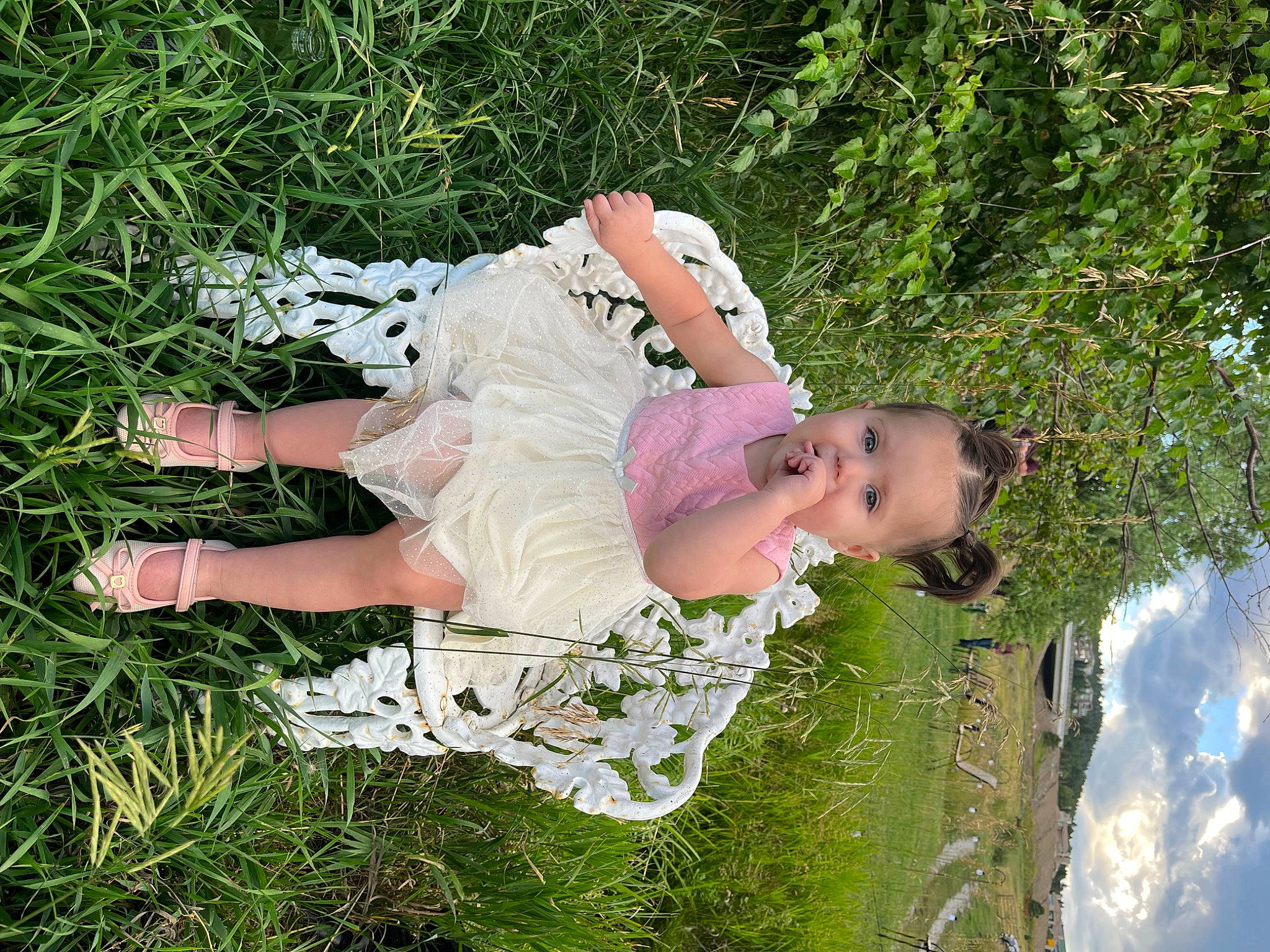 Isabella is registered to the contest to win money with this photo: child, cloud, dress, flash_photography, fun, grass, grassland, happy, leisure, meadow, people_in_nature, person, plant, sky, sunlight, toddler, tree
