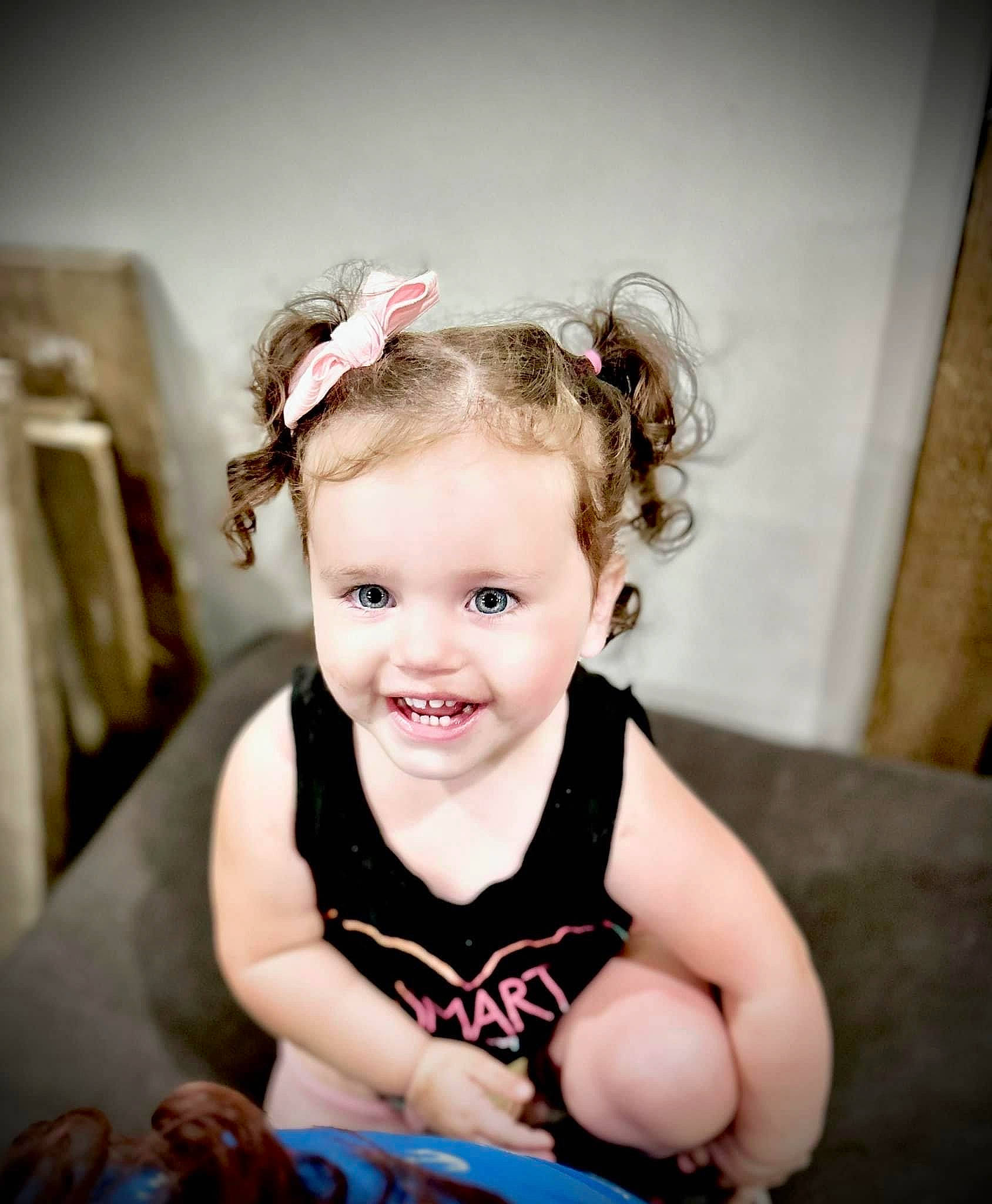 Harlee is registered to the contest to win money with this photo: baby, baby_toddler_clothing, cheek, child, eyelash, fashion_accessory, flash_photography, fun, hair_accessory, happy, headband, headpiece, iris, jewellery, joy, person, personal_protective_equipment, sitting, skin, sleeve