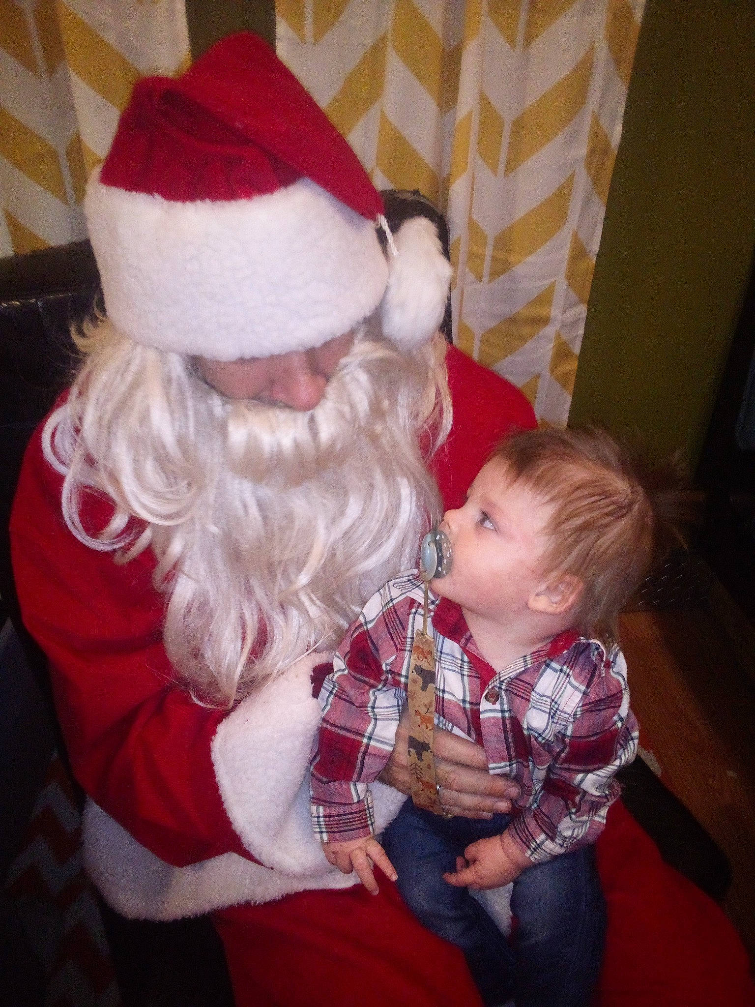 Owen joined the competition — help win amazing prizes! baby, beard, carmine, child, christmas_eve, comfort, costume_hat, event, facial_expression, fictional_character, fun, fur, hat, head, holiday, human_body, lap, person, santa_claus, sitting
