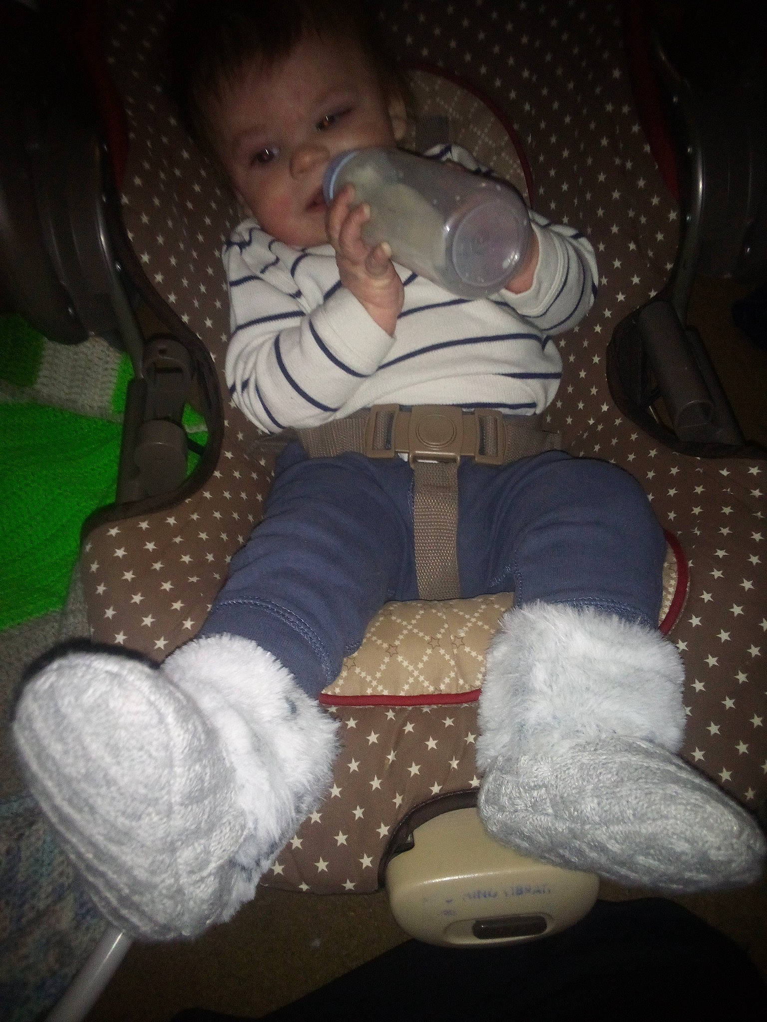 Owen is registered to the contest to win money with this photo: baby, baby_products, baby_toddler_clothing, carmine, child, comfort, finger, flooring, foot, fun, human_leg, knee, lap, linens, pattern, person, sitting, sleeve, sock, thigh