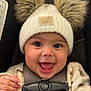 baby, child, smile, happy, hat, pom_poms, knit_hat, car_seat, harness, cute, infant, face, eyes, clothing, warm, outdoor_gear, closeup, portrait, baby_clothes, expression