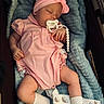 baby, sleeping, pacifier, headband, pink_clothing, blanket, socks, rainbow_pattern, infant, cute, cozy, resting, soft_texture, child, portrait, indoors, peaceful, newborn, baby_girl, comfort