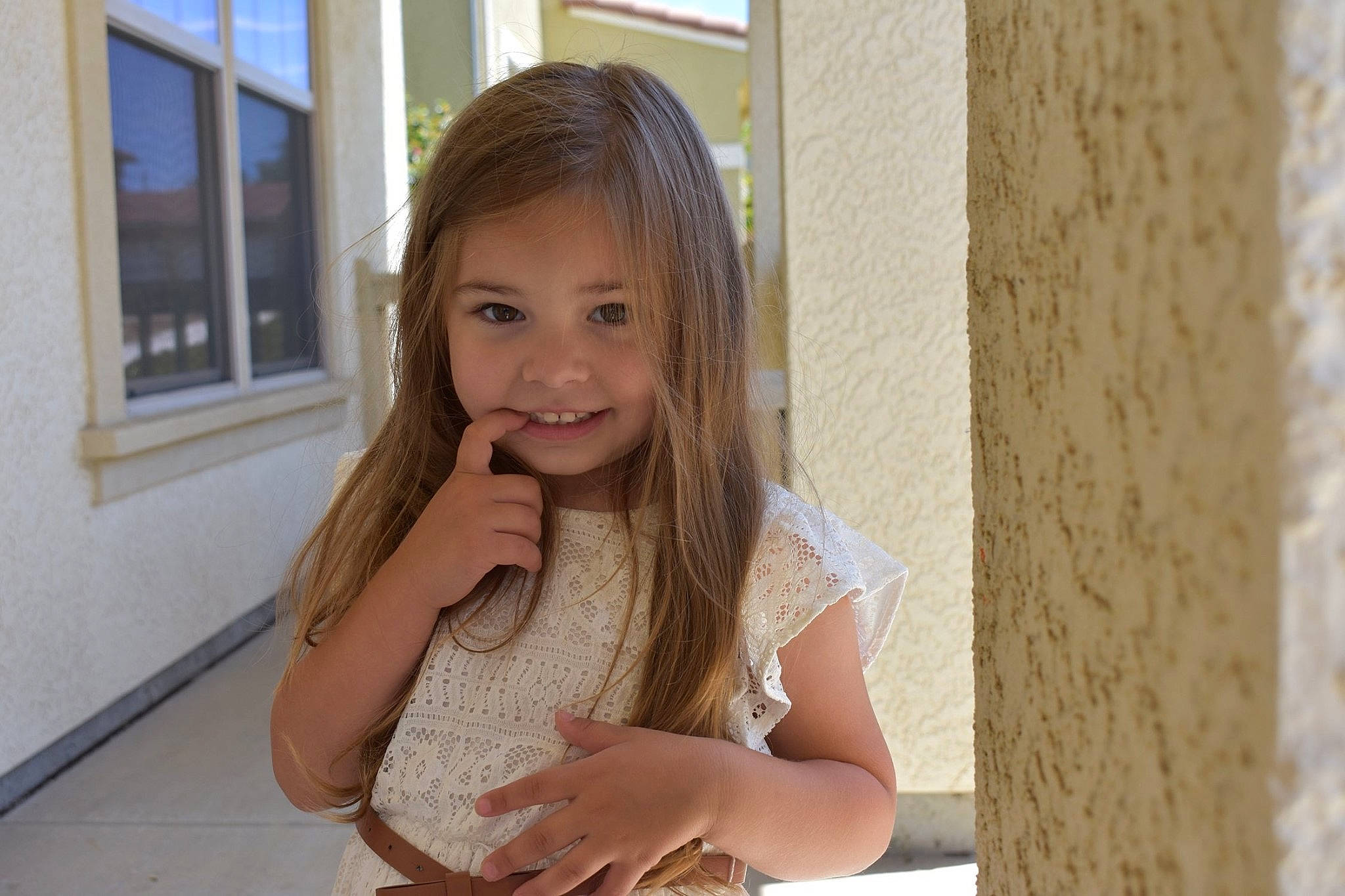 Snow is registered to the contest to win money with this photo: blond, child, child_model, fawn, hair, joy, long_hair, person, photography, sitting, smile, toddler, vacation, window, wood