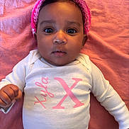 Xyla joined the competition — help win amazing prizes! baby, bunny_ears, child, curious_expression, cute, drool, face, headwear, indoor, infant, lying_down, newborn, onesie, person, pink_blanket, pink_headband, portrait, soft_texture, white_clothing, wide_eyes