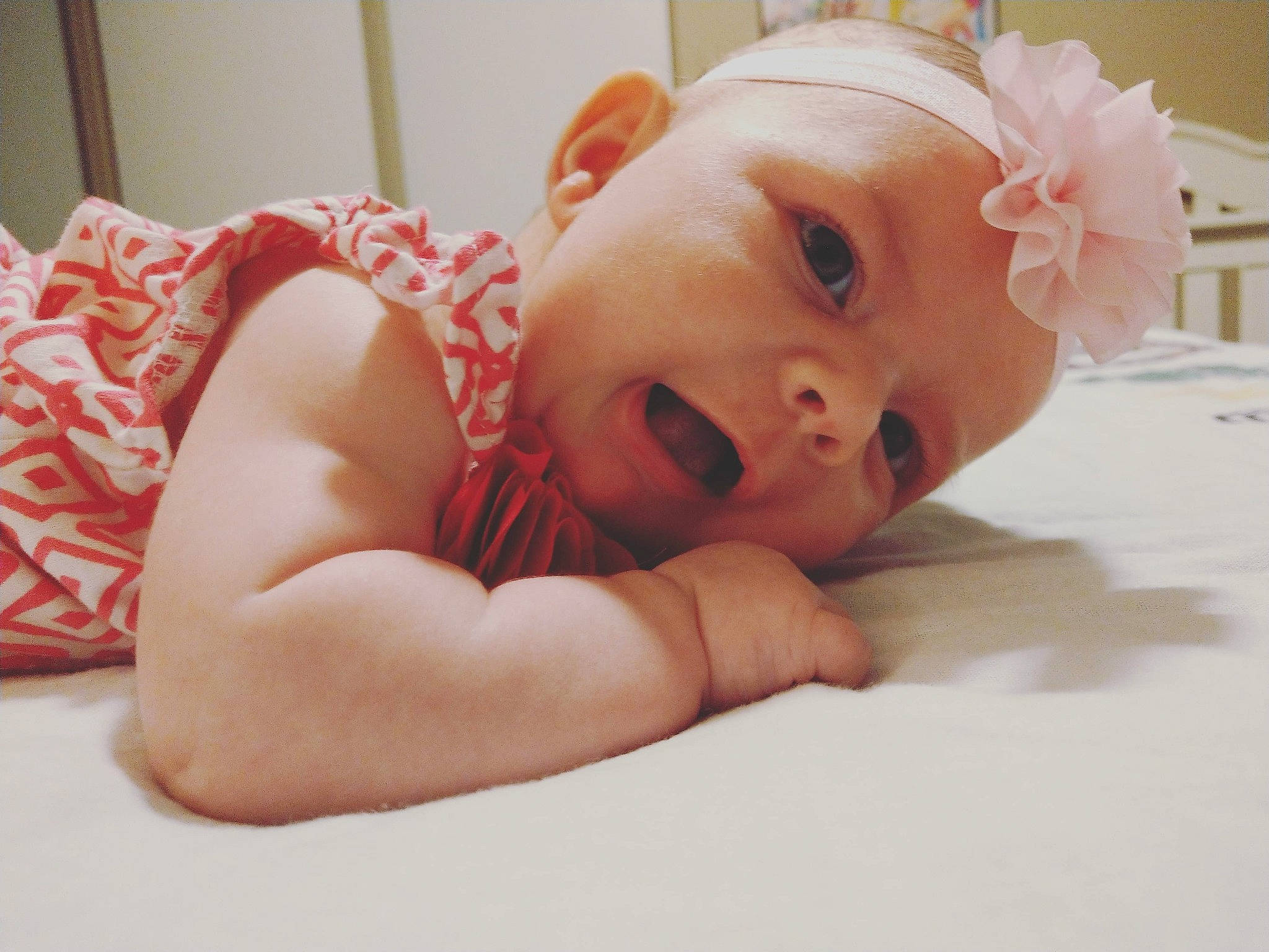Harlowe joined the competition — help win amazing prizes! baby, baby_toddler_clothing, cheek, chest, child, comfort, eye, eyelash, finger, floor, flooring, happy, headgear, headpiece, human_leg, iris, lip, person, sitting, skin