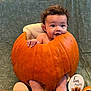 Ryklyn is registered to the contest to win money with this photo: baby, pumpkin, curly_hair, milestone, four_months, orange, blanket, milestone_sign, infant, smiling, celebration, cute, holiday, autumn, child, face, sitting, decor, happy, portrait