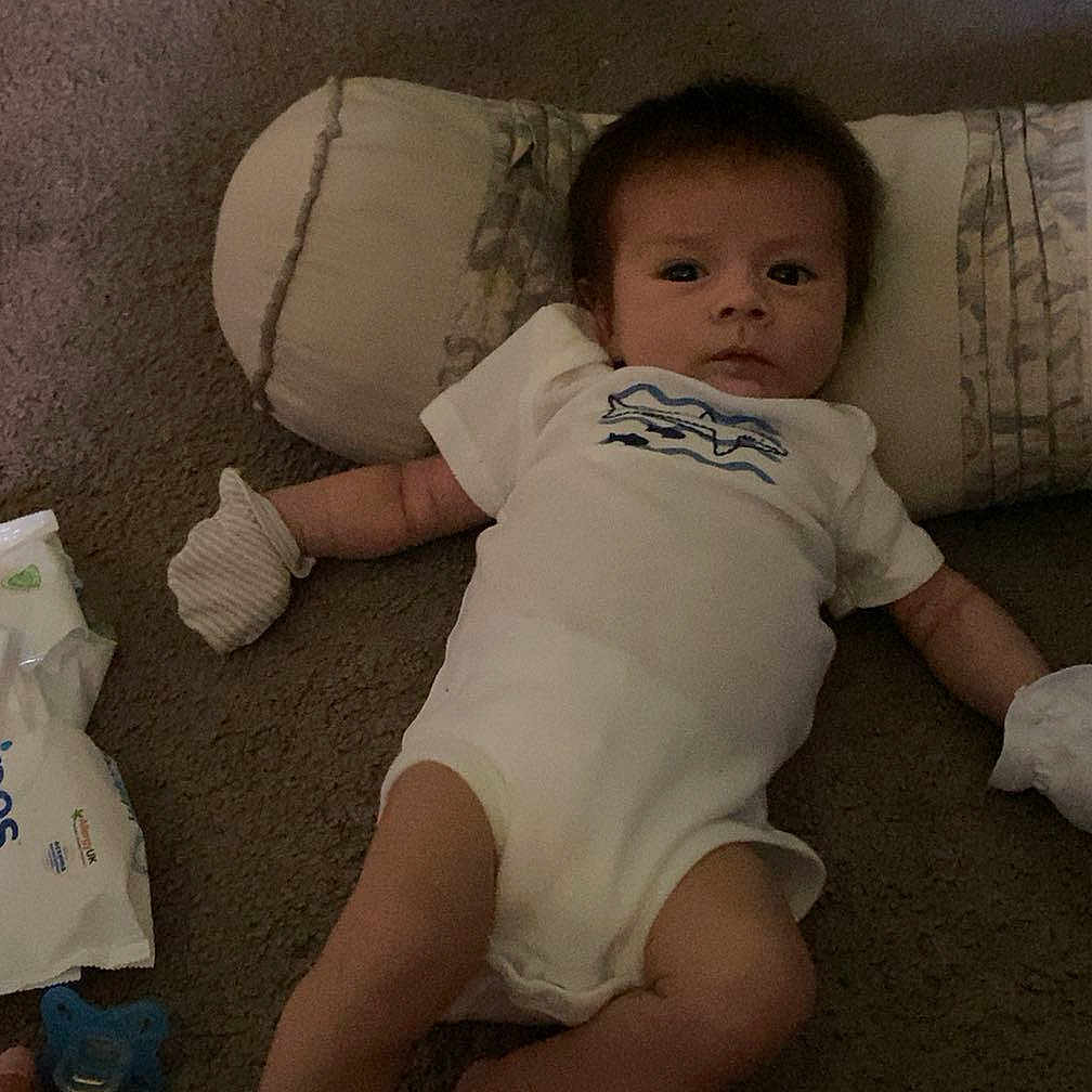 Zakiah is registered to the contest to win money with this photo: animal, baby, bed, bedroom, cat, couch, cushion, diaper, face, furniture, head, homedecor, indoors, newborn, person, pet, photography, pillow, portrait, sleeping