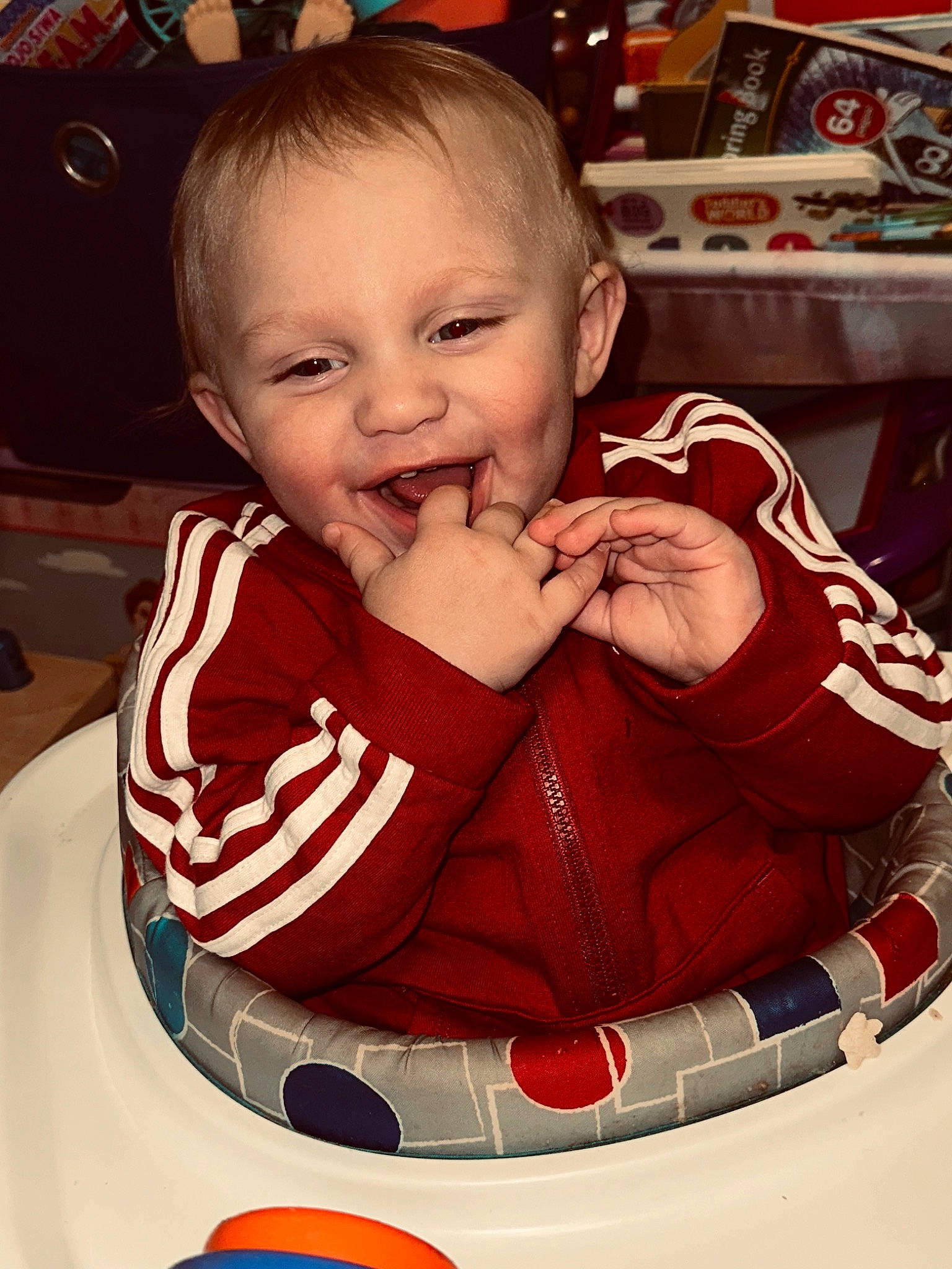 Vincenzo is registered to the contest to win money with this photo: baby, baby_products, baby_toddler_clothing, chair, cheek, child, eyelash, finger, fun, happy, head, lip, mouth, nose, person, shelf, sitting, skin, sleeve, smile