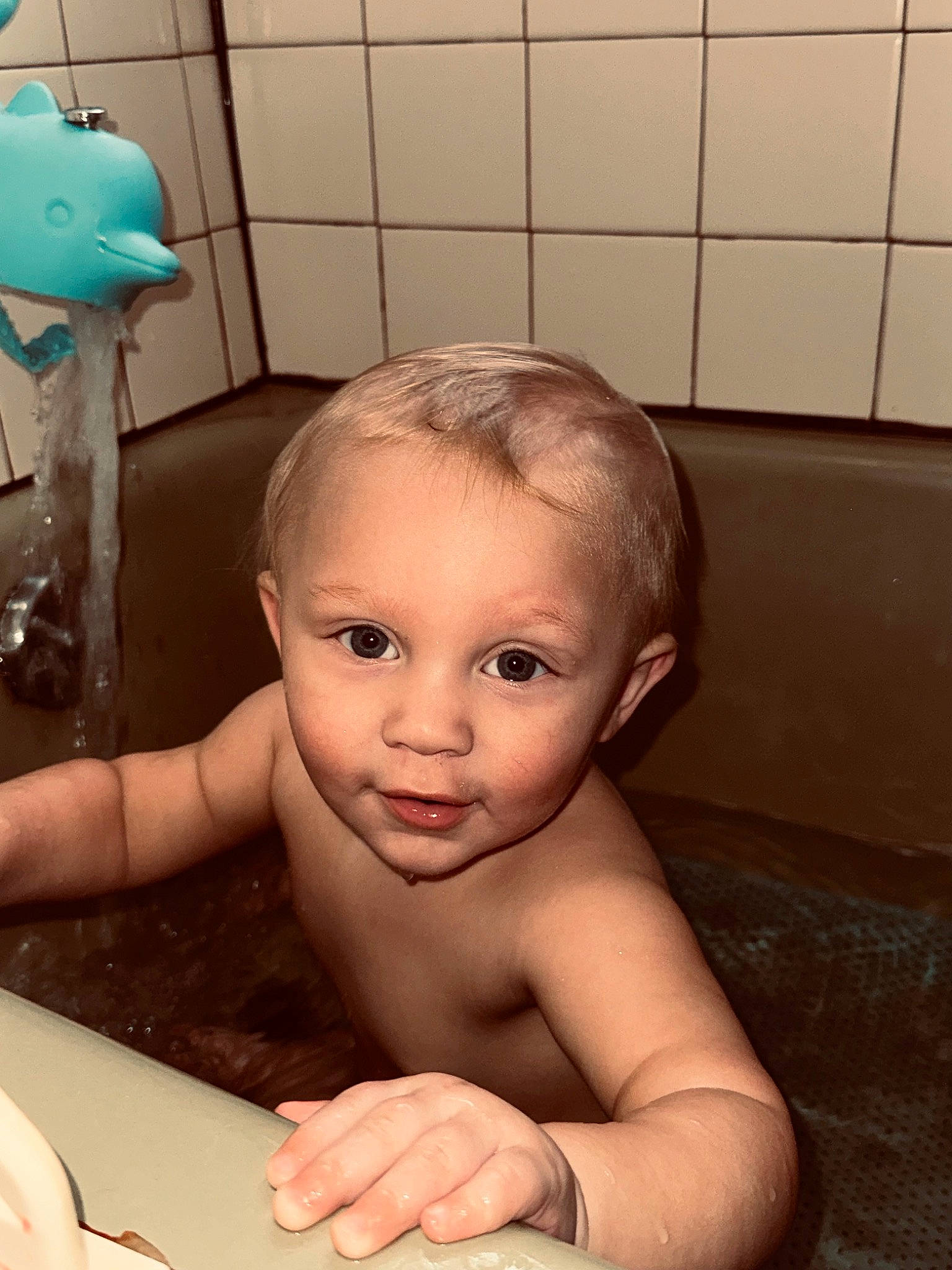 Vincenzo is registered to the contest to win money with this photo: arm, baby, baby_bathing, bathing, bathroom, bathtub, cheek, eyebrow, facial_expression, finger, hairstyle, hand, head, mouth, nose, organ, person, plumbing, plumbing_fixture, skin