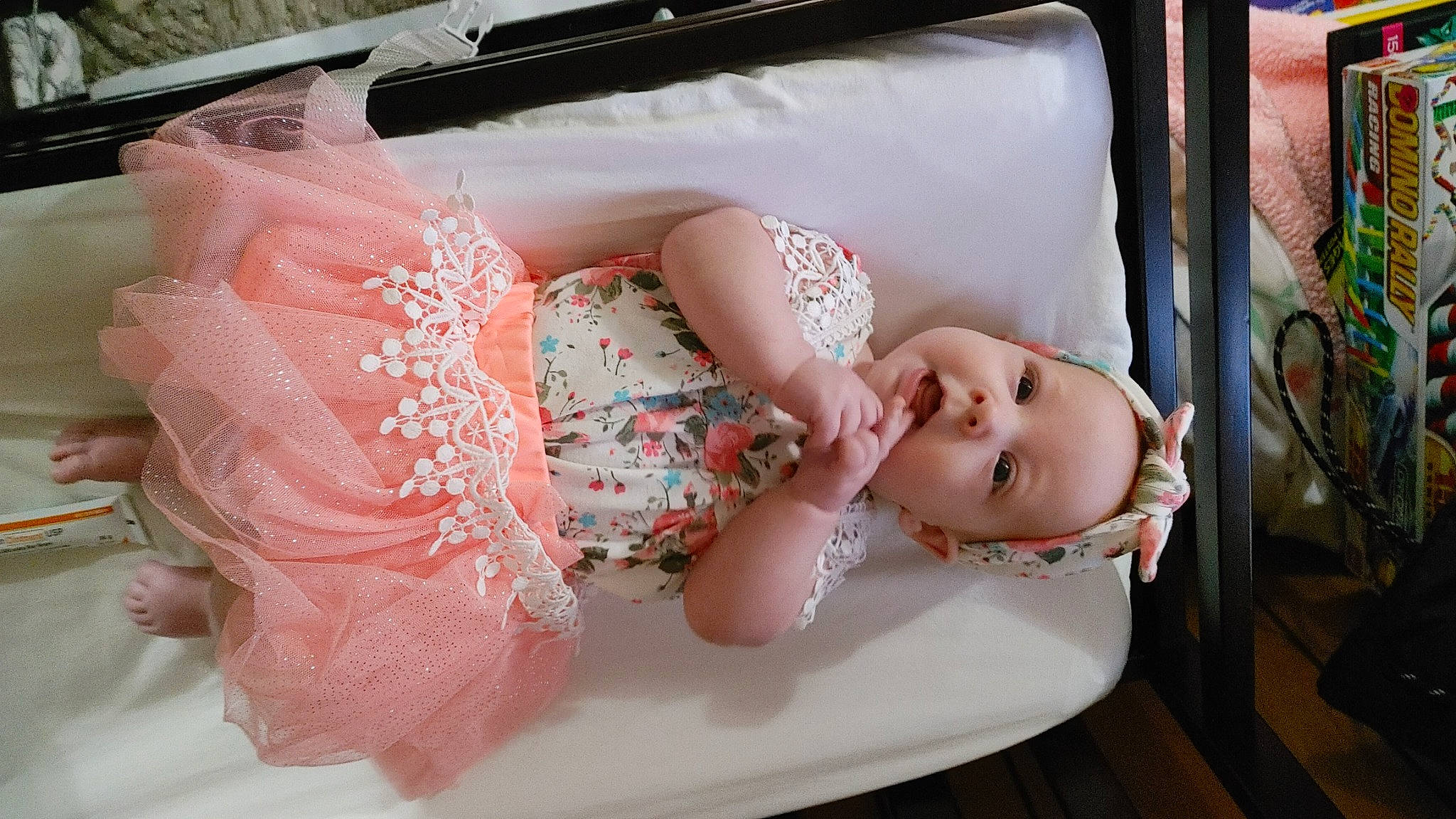 Addisyn is registered to the contest to win money with this photo: baby, baby_products, baby_safety, baby_toddler_clothing, bathing, cheek, child, comfort, doll, dress, embellishment, headgear, linens, pattern, peach, person, pink, product, textile, toddler