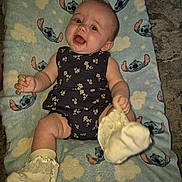 Alana is registered to the contest to win money with this photo: baby, bed, blanket, clothing, crib, cushion, diaper, face, furniture, head, homedecor, hosiery, infantbed, newborn, person, photography, portrait, quilt, sitting, sock