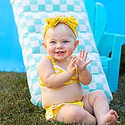 Addileyn joined the competition — help win amazing prizes! baby, child, smiling, yellow_bikini, headband, polka_dot, grass, outdoor, sunny, blue_eyes, happy, clapping, cheerful, summer, checkered_cushion, blue_chair, cute, sitting, barefoot, portrait