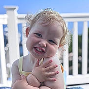 Penelope joined the competition — help win amazing prizes! toddler, child, smile, curly_hair, blond, outdoor, sunlight, railing, blue_sky, portrait, happy, cute, skin, face, arms, sleeveless, person, baby, expression, daylight