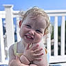 toddler, child, smile, curly_hair, blond, outdoor, sunlight, railing, blue_sky, portrait, happy, cute, skin, face, arms, sleeveless, person, baby, expression, daylight