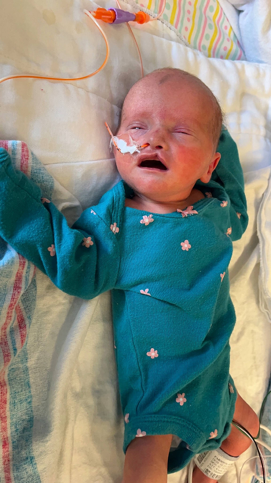 Harper is registered to the contest to win money with this photo: azure, baby, baby_products, baby_safety, baby_sleeping, baby_toddler_clothing, button, cheek, child, collar, comfort, happy, linens, pattern, person, sitting, skin, sleeve, textile, toddler