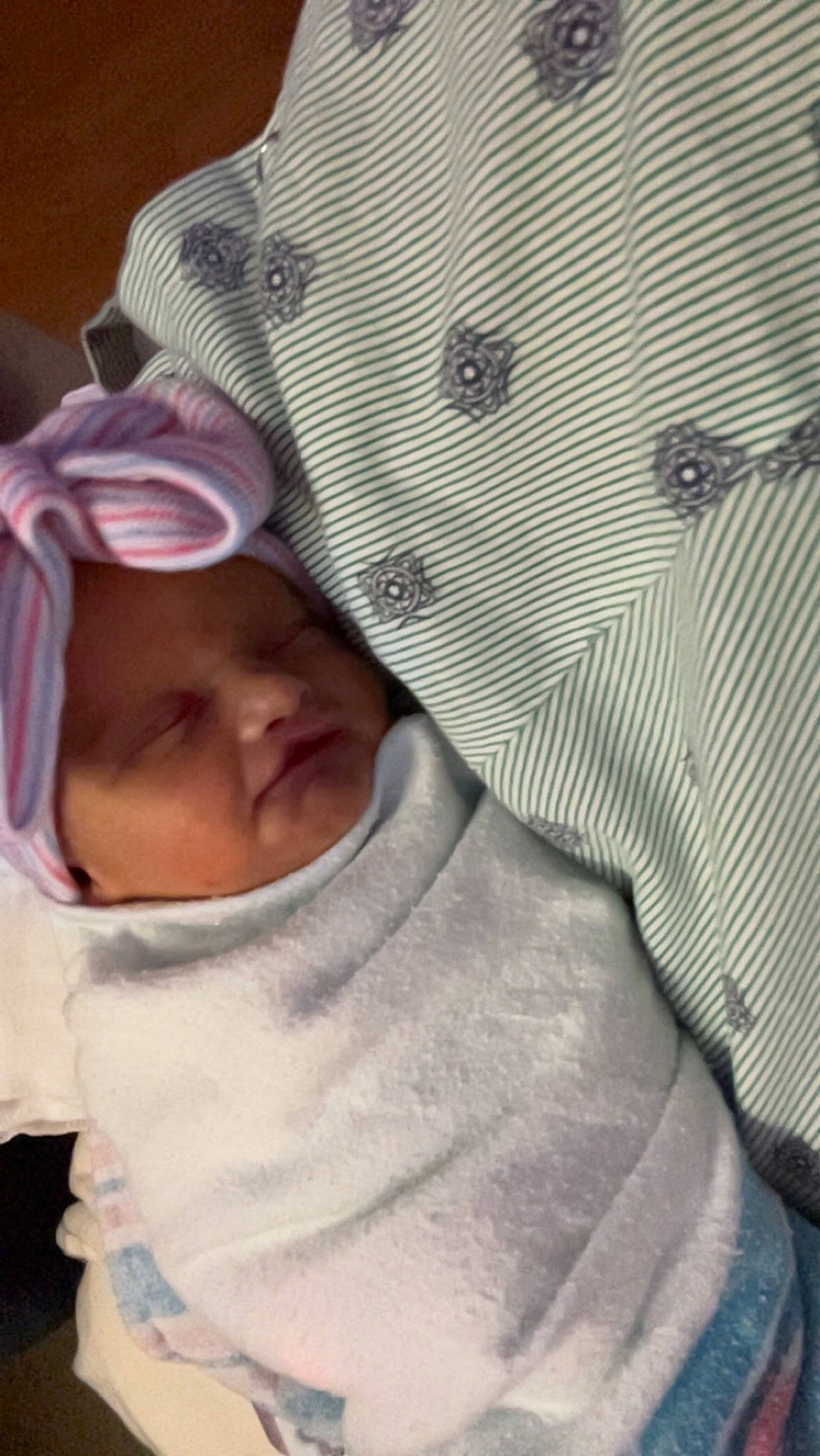 Harper is registered to the contest to win money with this photo: baby, baby_products, baby_sleeping, bedding, cap, cheek, chest, child, close_up, comfort, eyebrow, facial_expression, headwear, linens, mouth, nose, pattern, person, skin, sleeve