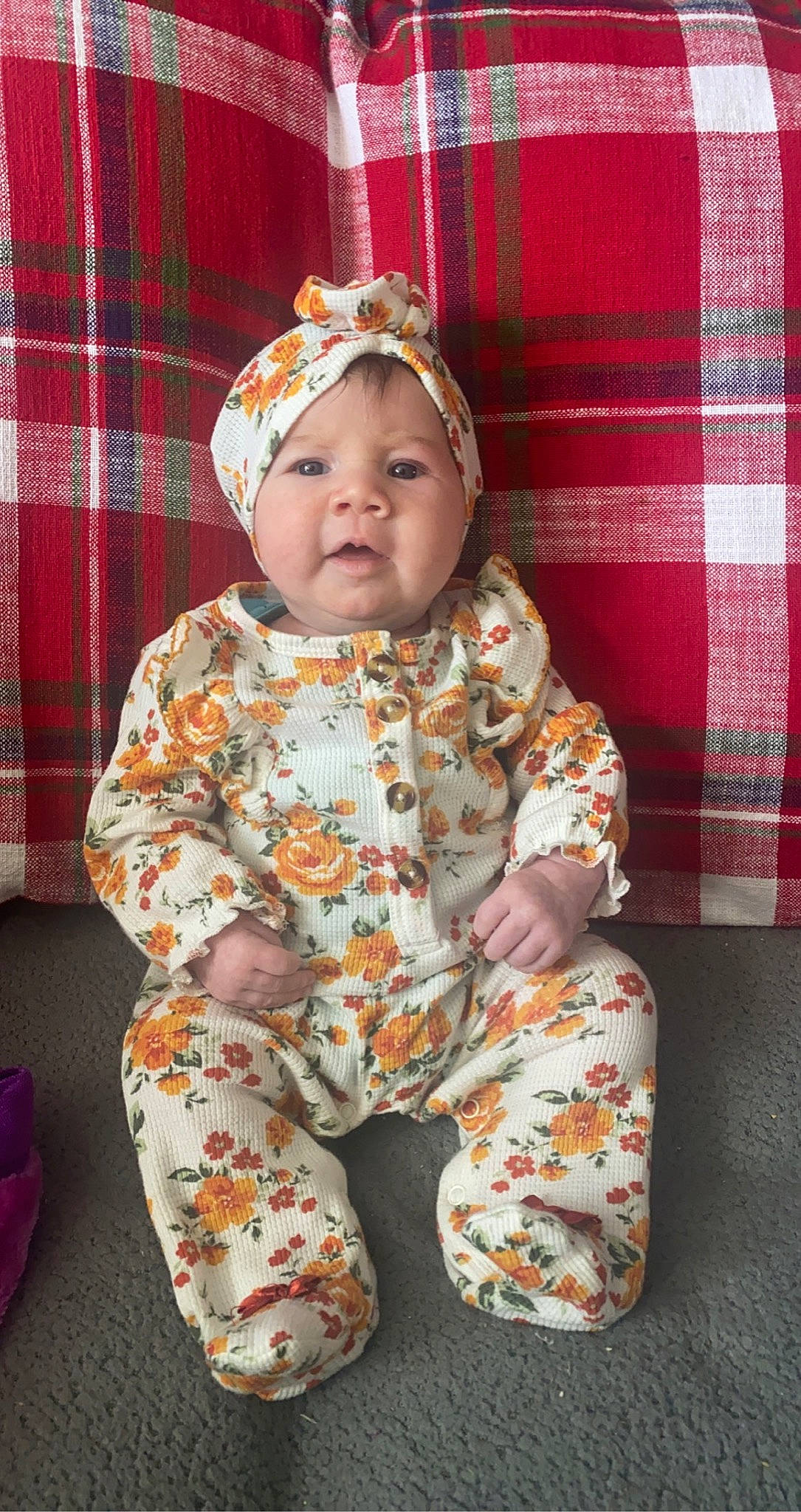 Stella joined the competition — help win amazing prizes! baby, baby_toddler_clothing, child, comfort, costume, curtain, flooring, fun, head, headwear, linens, nightwear, pattern, person, plaid, red, room, sitting, sleeve, tartan