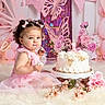 Alana is registered to the contest to win money with this photo: child, toddler, birthday, cake, pink, dress, smiling, portrait, balloons, flowers, roses, butterflies, party, celebration, indoors, studio, curly_hair, hair_bows, furry_blanket, decorations
