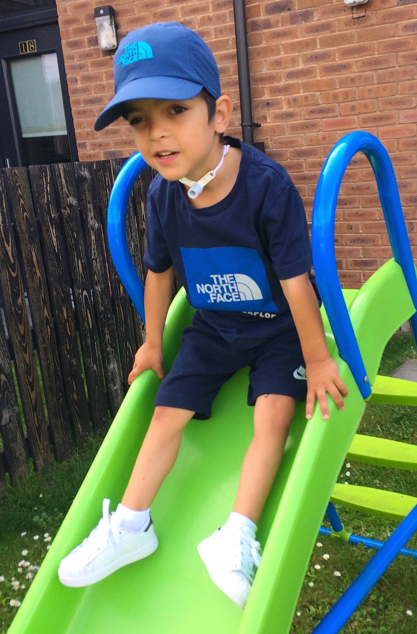 Markis is registered to the contest to win money with this photo: child, city, electric_blue, fun, headwear, human_settlement, leisure, outdoor_play_equipment, person, play, playground, playground_slide, public_space, recreation