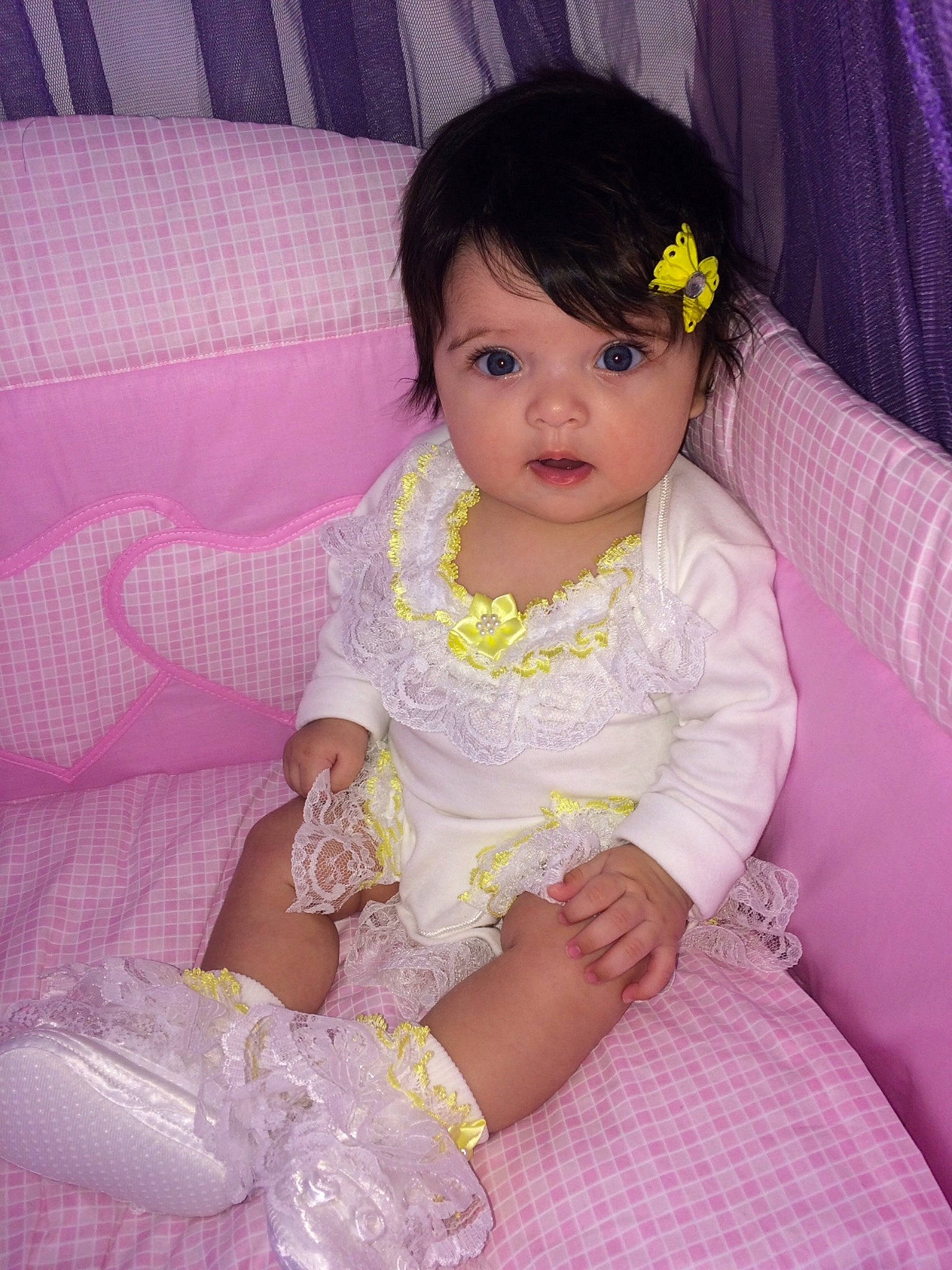 Marissa is registered to the contest to win money with this photo: baby, beauty, bed, cheek, child, daughter, dress, eye, iris, leg, lilac, lip, person, pink, purple, sitting, skin, smile, textile, toddler