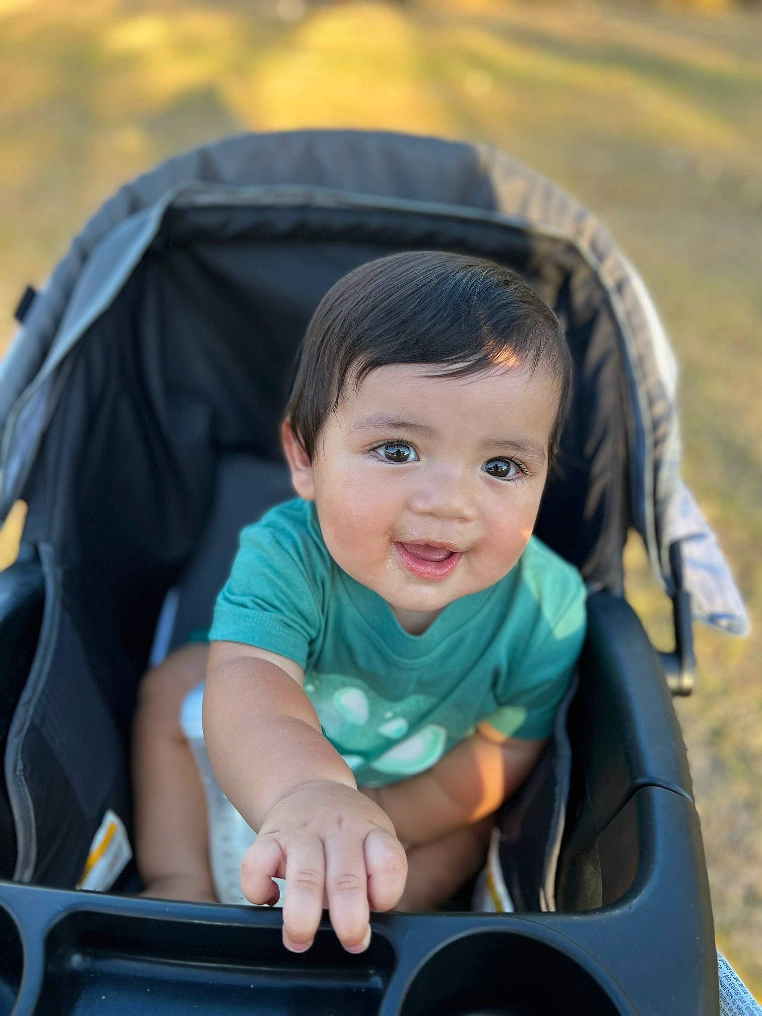 Kayson is registered to the contest to win money with this photo: auto_part, baby, baby_carriage, baby_products, child, comfort, electric_blue, fun, grass, happy, leisure, motor_vehicle, people_in_nature, person, recreation, sitting, smile, toddler, travel, vacation