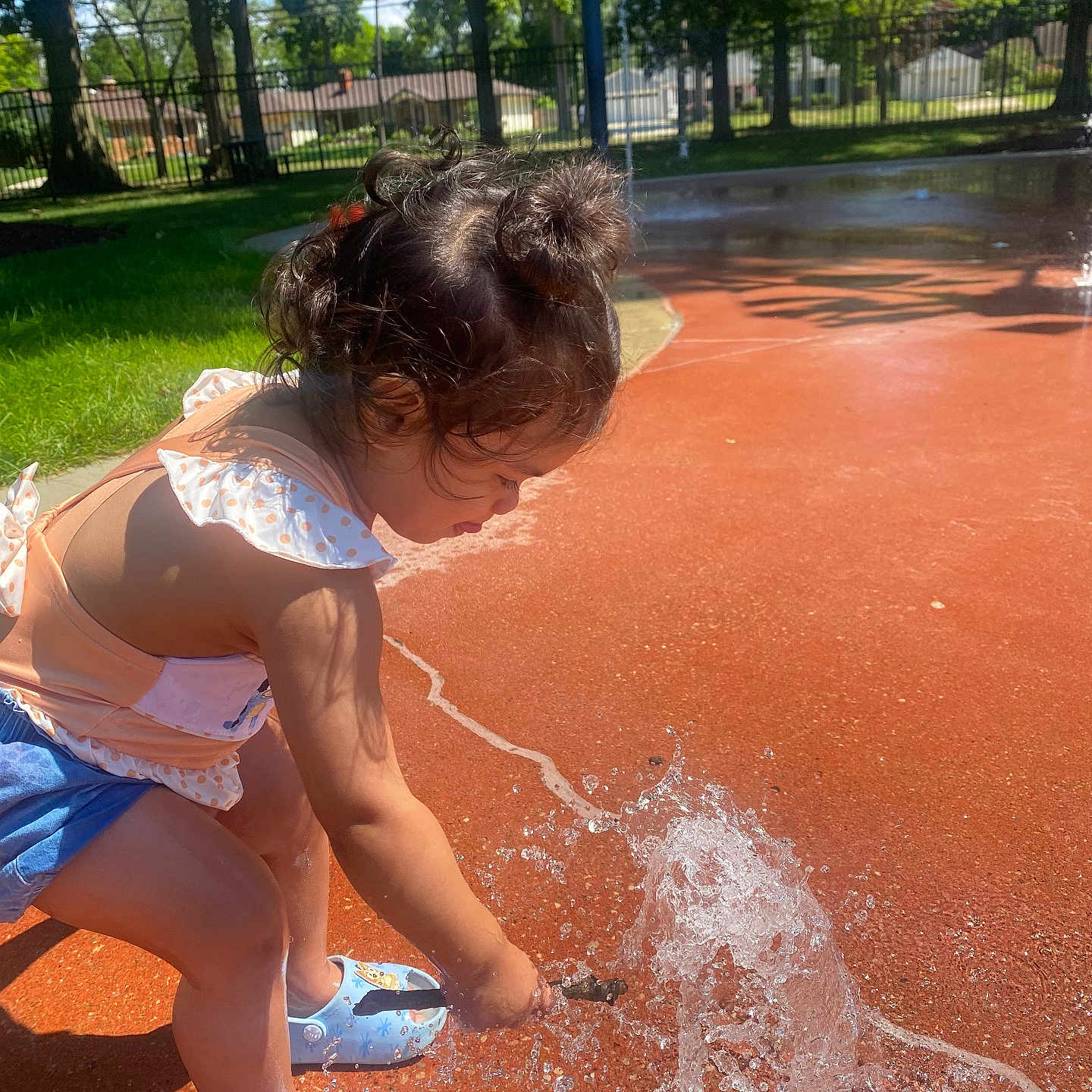 Anaaya is registered to the contest to win money with this photo: architecture, child, clothing, face, female, fountain, girl, grass, head, nature, outdoors, park, person, photography, plant, portrait, shorts, summer, tree, water