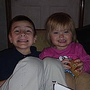 Jason is registered to the contest to win money with this photo: child, children, smiling, indoor, door, toy, box, pants, shirt, person, happy, face, sitting, young, kid, playful, family, home, casual, portrait