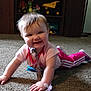 baby, crawling, carpet, indoor, toy, pacifier, smiling, child, clothing, pink_pants, tie, floor, furniture, shelf, stuffed_toy, happy, person, home, infant, cute