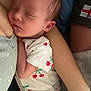 newborn, baby, sleeping, infant, onesie, cherry_pattern, arm, skin, closeup, peaceful, resting, person, family, cuddle, soft, cute, toddler, child, portrait, indoors