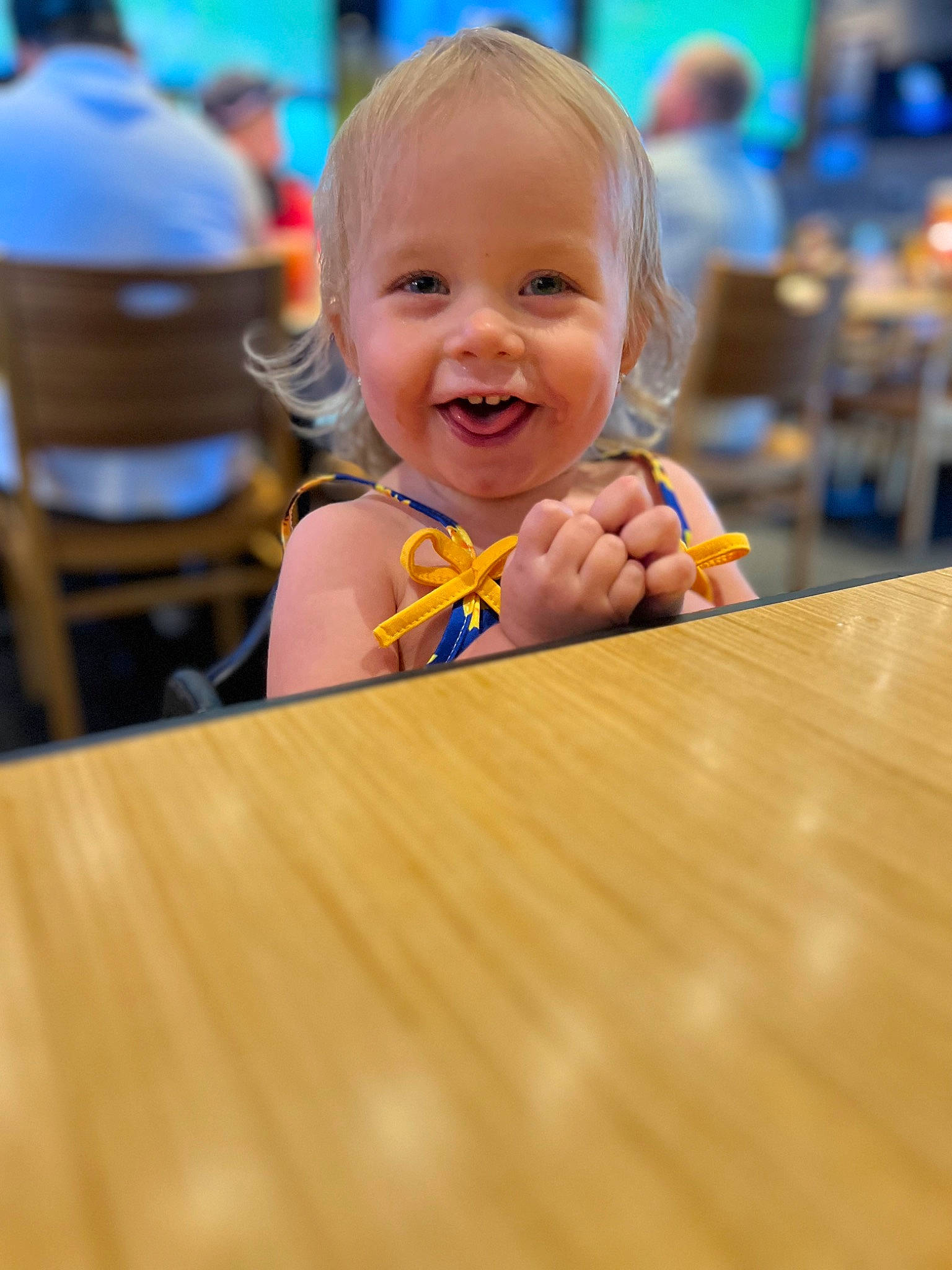 Kristina is registered to the contest to win money with this photo: baby, baby_toddler_clothing, blond, cheek, child, event, floor, flooring, fun, happy, hardwood, iris, joy, leisure, person, recreation, sitting, smile, table, toddler