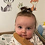 animal_wall_stickers, baby, baby_girl, child, clothing, comb, curly_hair, cute, expression, face, fox, hand, indoor, infant, patterned_shirt, portrait, soft_lighting, wall_decor, wolf, wooden_comb